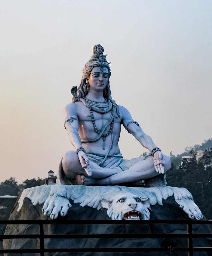 Stunning Lord Shiva statue in Rishikesh at dusk showcasing divine peace and serenity.